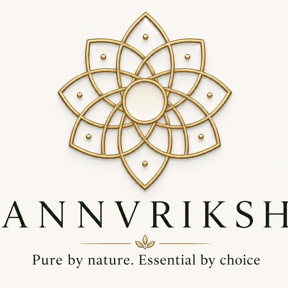 The ANNVRIKSH emblem — a blossoming flower of interwoven gold petals